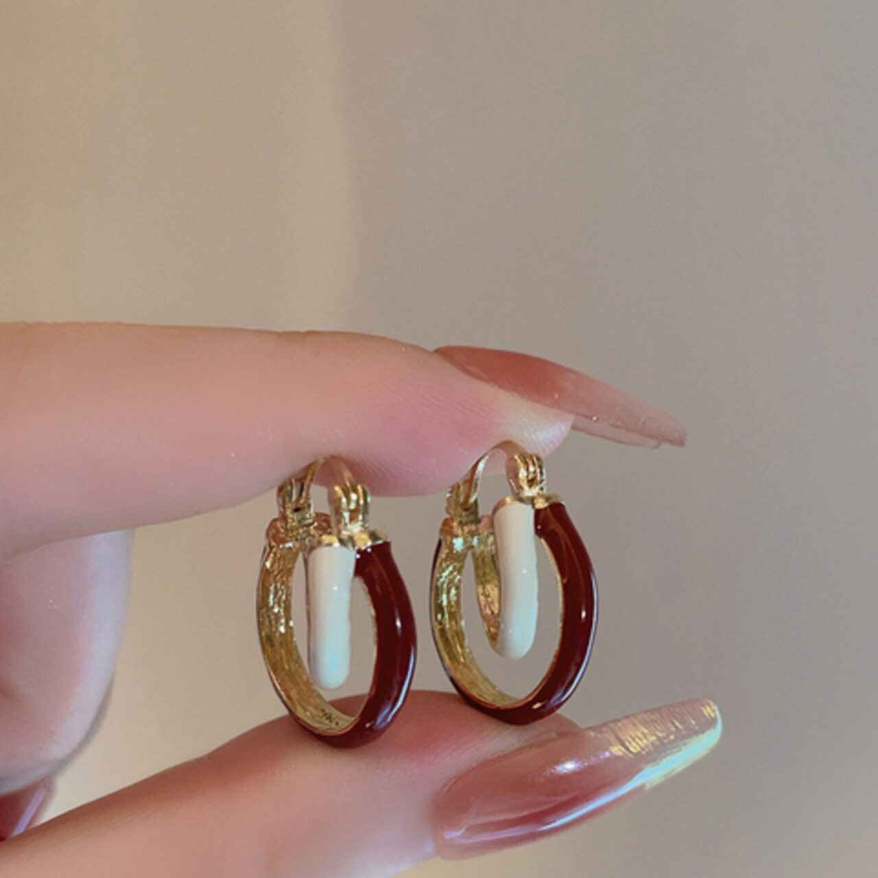 骨格ウェーブ ツイストリングピアス